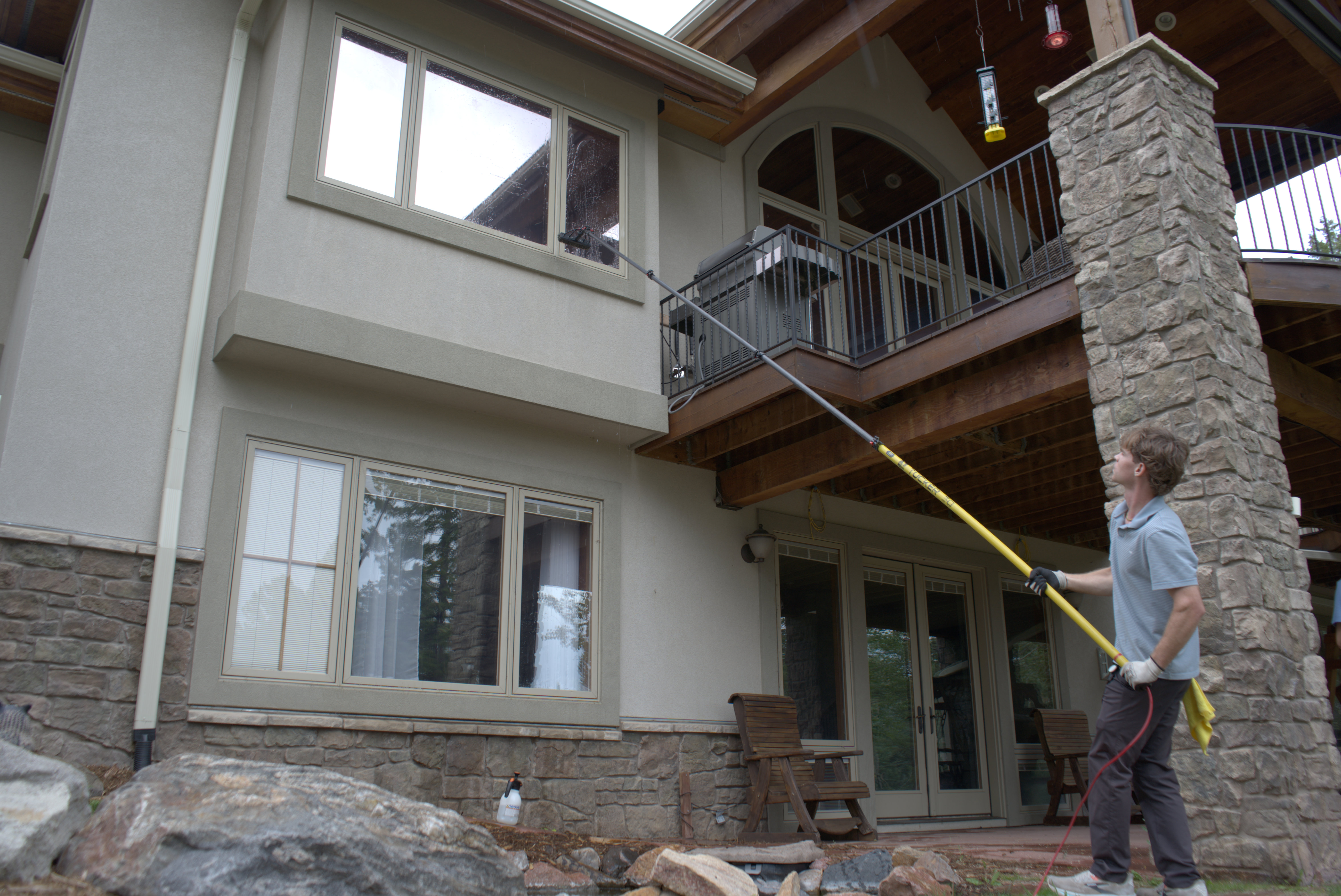 Ascent Exteriors owners working together on a large Denver-area home